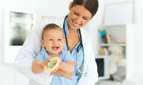 Pediatric nurse practitioner smiling with patient